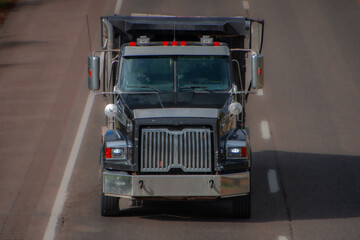 Heavy truck on a Canadian highway in the fall in Quebec