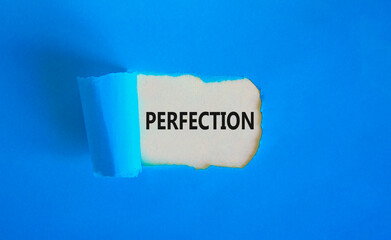 Perfection symbol. Concept word Perfection on beautiful white paper. Beautiful blue paper background. Business perfection concept. Copy space.