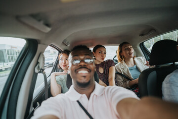 A group of international business people sharing a light moment during a car ride in the urban...