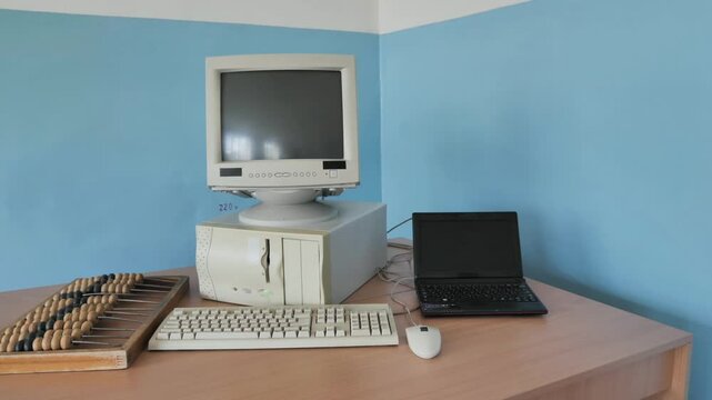 Exposition Of Old Style Computer, Retro Abacus Counting Frame And Modern Laptop. PC Progress
