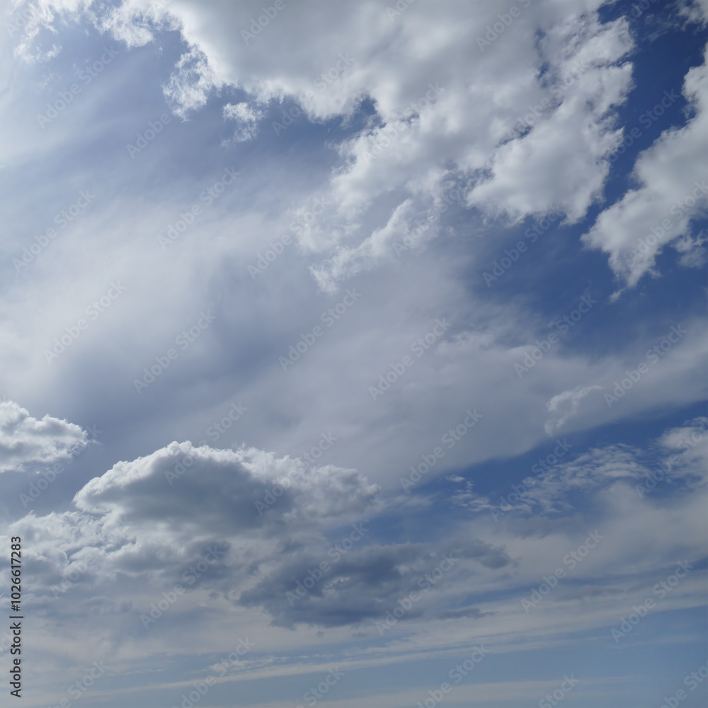 Wall mural Sun on beautiful blue sky with white clouds.