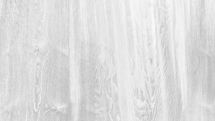 A wooden surface with a grainy texture. The wood is grey and has a natural look. The surface is smooth and has a slight shine to it