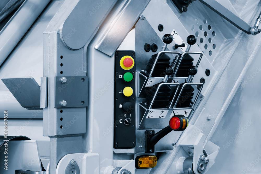Poster machine hydraulic or pneumatic with joysticks and levers and buttons for control. industrial concept