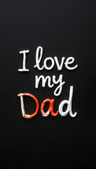 Obraz premium I love my dad handwritten on dark background isolated with white highlights, png