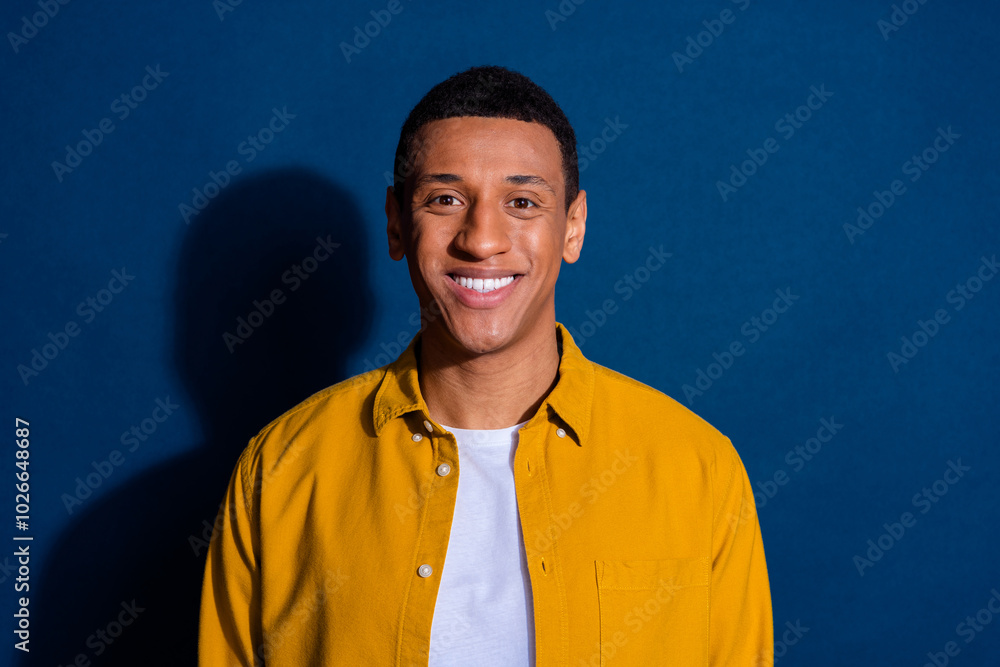 Wall mural Photo of young handsome toothy smile guy mode wearing yellow shirt posing for dentistry clinic isolated on dark blue color background