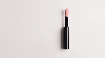 Obraz premium Matte liquid lipstick in a slim tube with the applicator slightly pulled out, floating against a white background