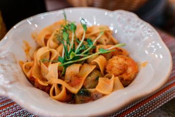 Pasta with shrimp with tomato sauce.