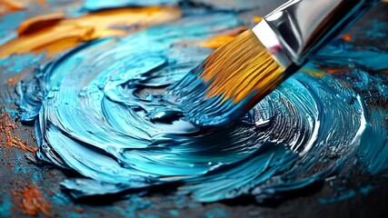 Close-up of paintbrush mixing vibrant blue and orange acrylic paint