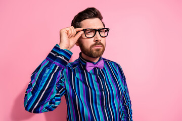 Fototapeta premium Photo of attractive handsome man wear stylish clothes hand hold glasses look camera isolated on pink color background