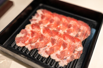 Close-up of sliced beef tongues on a plate