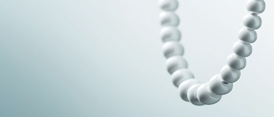  A white bead necklace, focus on close-up, against a plain white background Beads distinct, haze encircles adjacent blurred bead