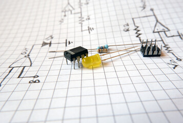 Project with semiconductor components. İntegrated circuit and a yellow LED on the electronic circuit diagrams. 