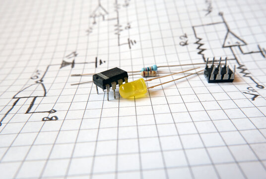 Project with semiconductor components. İntegrated circuit and a yellow LED on the electronic circuit diagrams. 