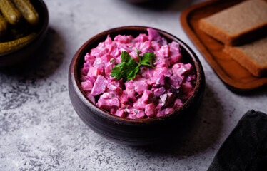 Beet hirring mayonnaise salad vinaigrette in a bowl