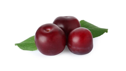 Ripe plums with leaves isolated on white