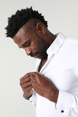  Headshot of African American handsome man wearing white shirt posing indoor. Vertical mock-up