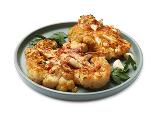 Delicious baked cauliflower steaks with garlic and parsley isolated on white