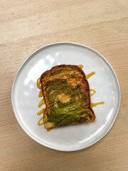 Matcha bread toast with honey drizzle.