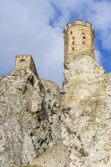 Two old bastions of Devin castle on the top of the rocks with slightly cloudy sky, Slovakia,...