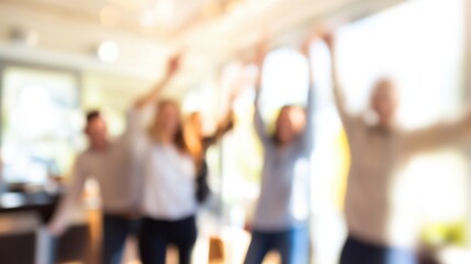 Fototapeta premium Group of happy colleagues celebrating during a business meeting, blurred image with copy space, simple and clean.
