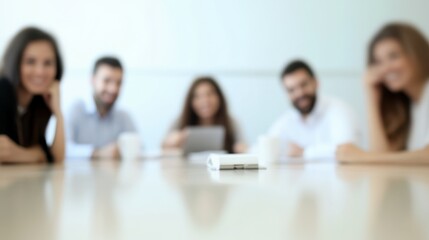 Joyful professionals enjoying a successful business meeting, blurred composition with copy space, minimal background focusing on their expressions.