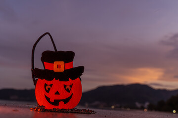 Concept: Halloween beach and ocean background with pumpkins, witches, ghosts, dark, scary tones.