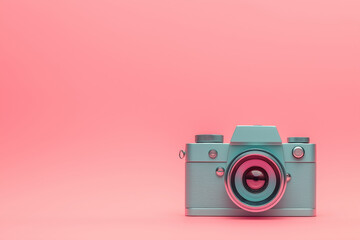 Fototapeta premium A vintage camera in pastel pink and mint green creates a nostalgic, playful, and colorful display in this image.