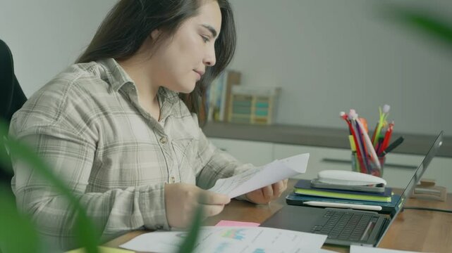 young woman study hard overnight brownout bored remote learn online read data tired sitting head in hands at home office desk workplace think worry in job tough stress workforce issue. High quality 4k