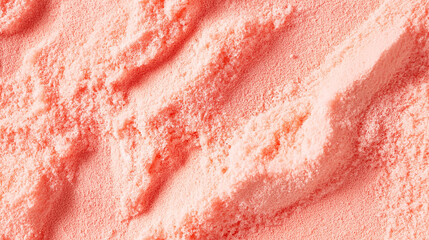 a close-up, top-down view of dried grapefruit powder, showcasing a soft pink-orange hue and fine, smooth texture