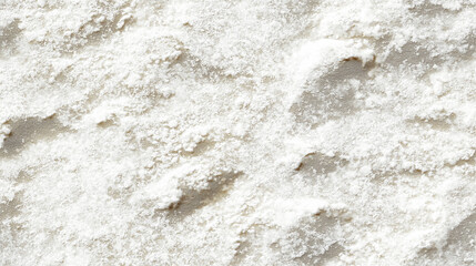 a close-up, top-down view of wheat flour, filling the entire frame with the focus on the finely milled, pure white powder