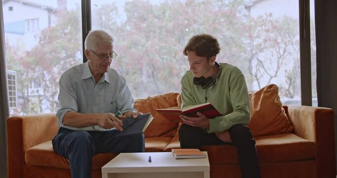 A student meets with their professor for a one-on-one session in the library after class, discussing homework and reviewing study materials to deepen their understanding and enhance their academic