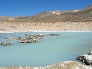 The Polloquere hot springs are natural hot springs located in the Chilean Altiplano. They are part of the Surire Salt Flat.