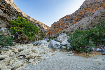Barren high rocky mountains of Kourtaliotiko gorge with clear blue sky, Greece, Crete island, wide angle lens