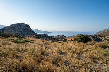 Barren landscape, beach with mountains and bays in the background, clear blue sky, early morning, landscape, wide-angle lens