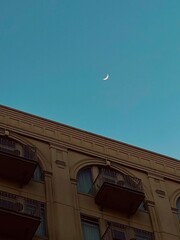 Crescent Moon Over Building in Texas