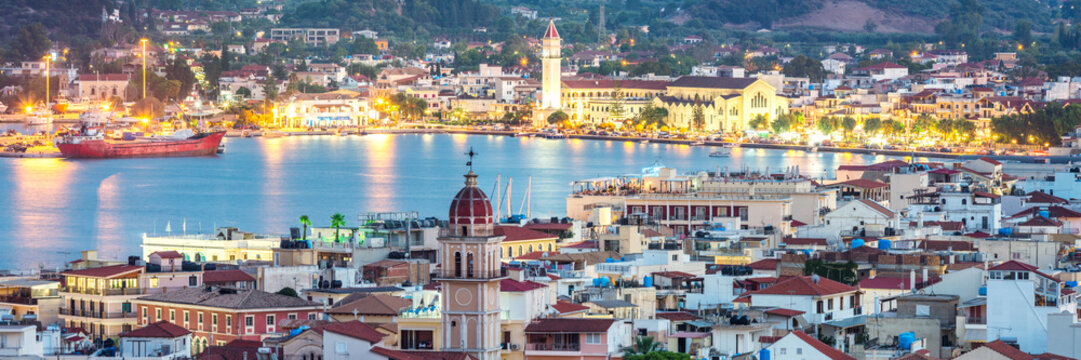 Panorama of Zakynthos town and harbour at dusk, Zakynthos, Greece