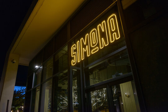 outdoor sign of Simona, an Italian restaurant, located at 59 Merchants' Wharf, in the waterfront area of Toronto, Canada