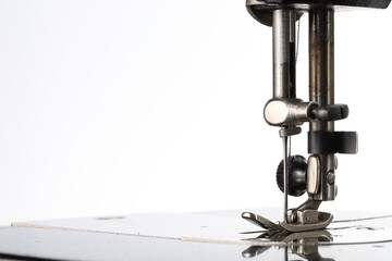 Sewing machine on white background, closeup view