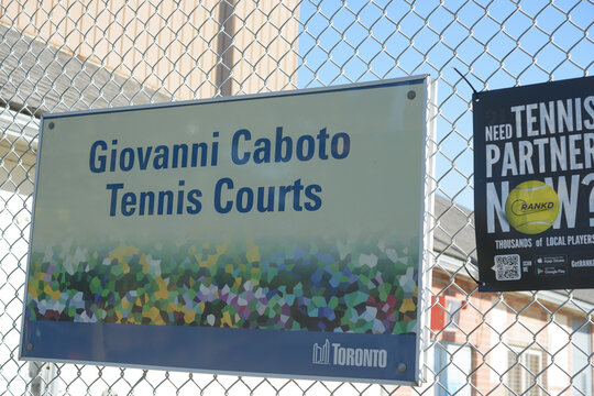 City of Toronto Giovanni Caboto Tennis Courts sign pinned to a chain link fence outdoors (1367 St Clair Avenue West)