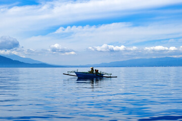 Indonesia Bunaken - Small fishing boats on the coast of Bunaken