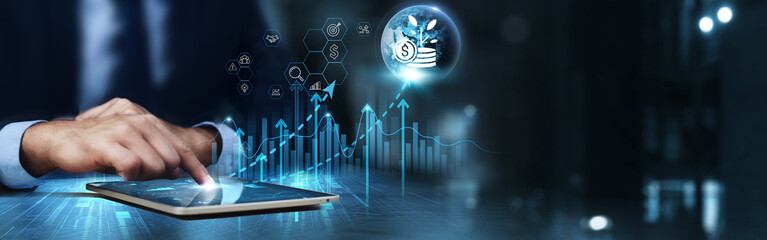 Investment: Businessman using tablet and analyzing technical growth by market trends, risk...