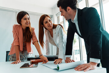 Businessman is in meeting discussion with colleague businesswomen in modern workplace office....