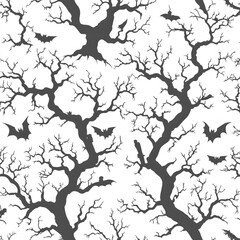 Halloween seamless pattern featuring tombstones, bats, and eerie trees