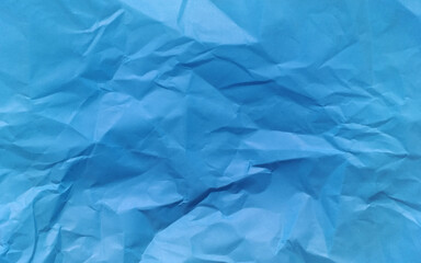 Torn piece of irregular crumpled paper vector. Colorful blue crumpled paper texture.