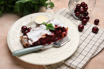Plate with piece of tasty cherry strudel, napkin and fresh berries on pink grunge background, closeup