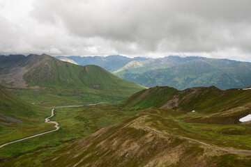 Aerial view of road in mountain valley near Hatcher Pass, Alaska landscape wilderness