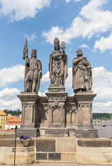 Fototapeta premium Sculpture of St Norbert St Wenceslas and St Sigismund by Ian Brokoff on the Charles Bridge in Prague in Czech Republic