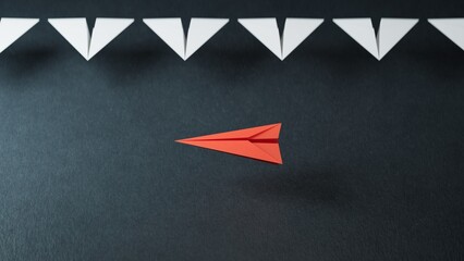 Different business concept.new ideas. paper art style. creative idea.Red and white paper plane. Leaderplane concept.3D rendering on black background.
