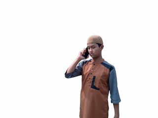 A Muslim teenager is talking on the phone with someone.isolated on white background