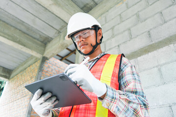 Construction Worker Using Tablet on Site